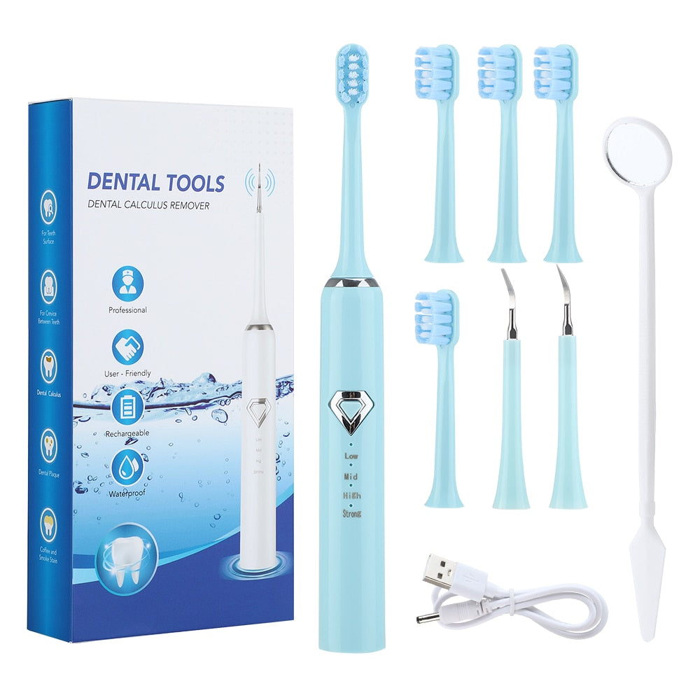 Dental Tartar Cleaner Electric Toothbrush with multiple cleaning heads and USB charging cable, designed for effective teeth whitening and tartar removal.