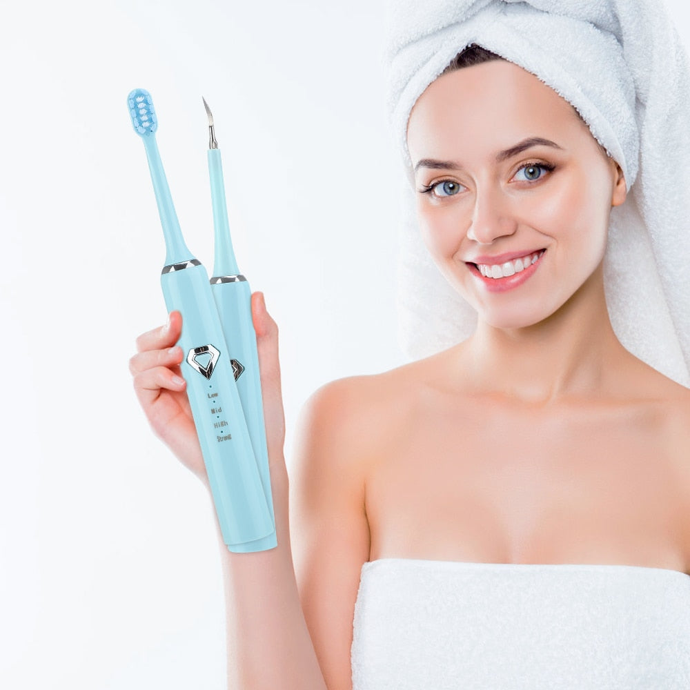 Dental Tartar Cleaner Electric Toothbrush with multiple cleaning heads and USB charging cable, designed for effective teeth whitening and tartar removal.