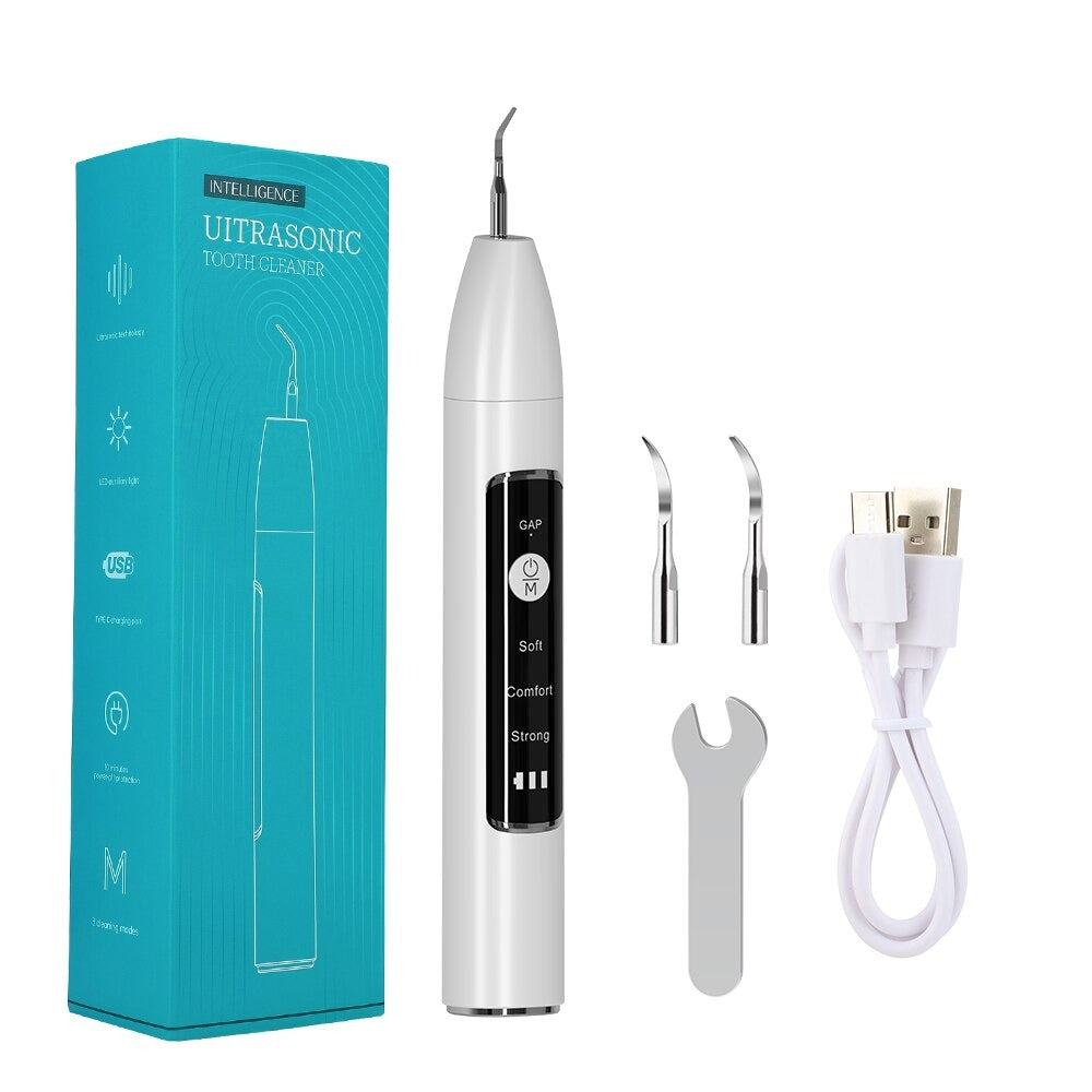 Electric Dental Tartar Scraper Ultrasonic Dental Scaler with multiple cleaning tips and charging cable, designed for effective teeth cleaning.