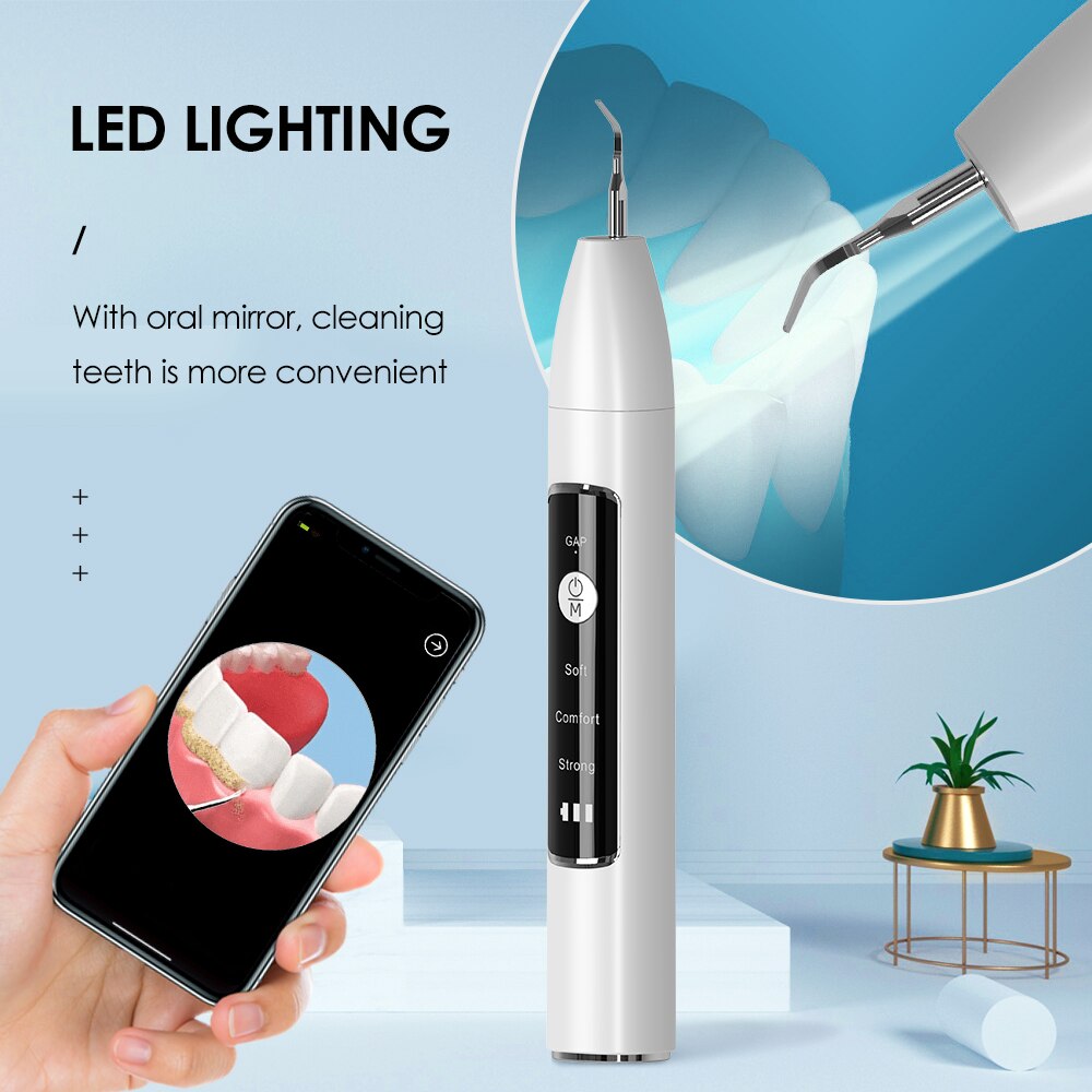 Electric Dental Tartar Scraper Ultrasonic Dental Scaler with multiple cleaning tips and charging cable, designed for effective teeth cleaning.