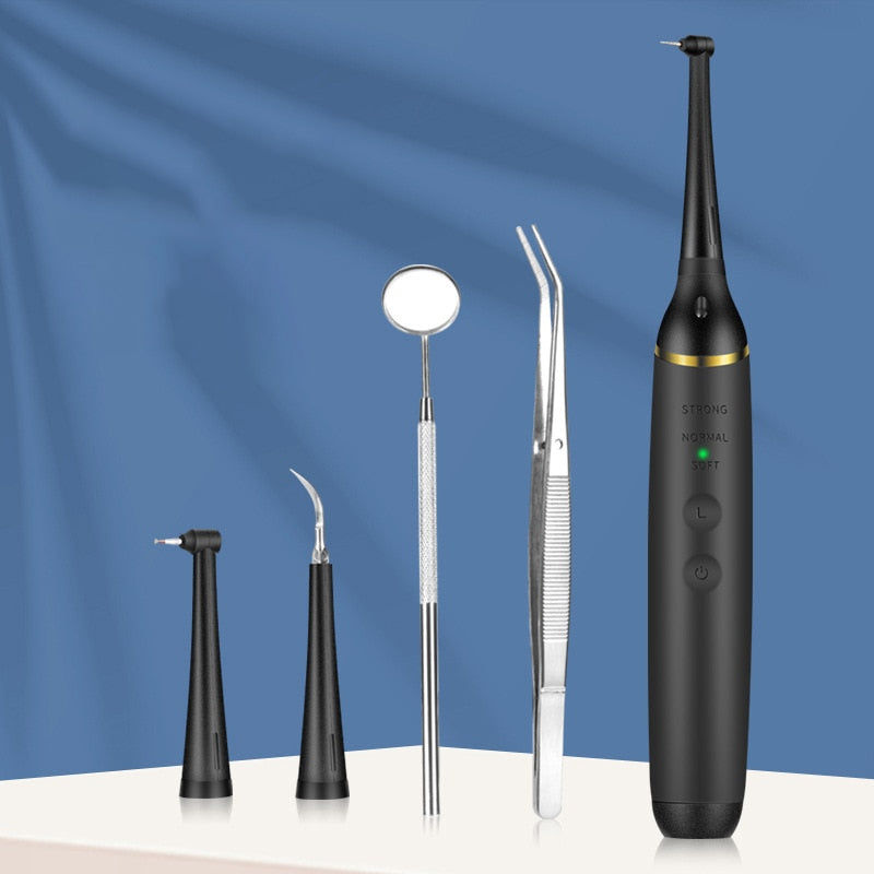 Electric Sonic Dental Scaler with LED light, featuring multiple cleaning heads and a sleek design for effective tooth cleaning.