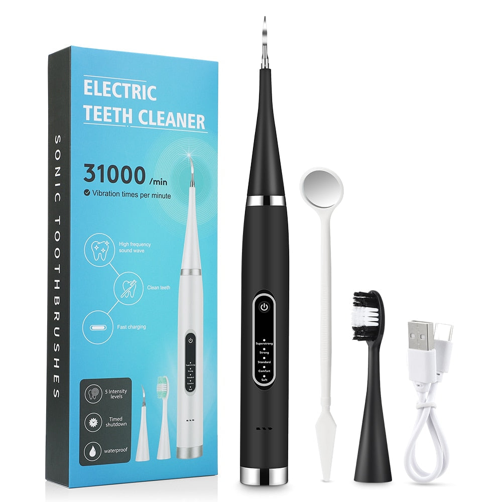 Electric Teeth Tartar Cleaner with multiple brush heads and USB charging cable, designed for effective dental care.