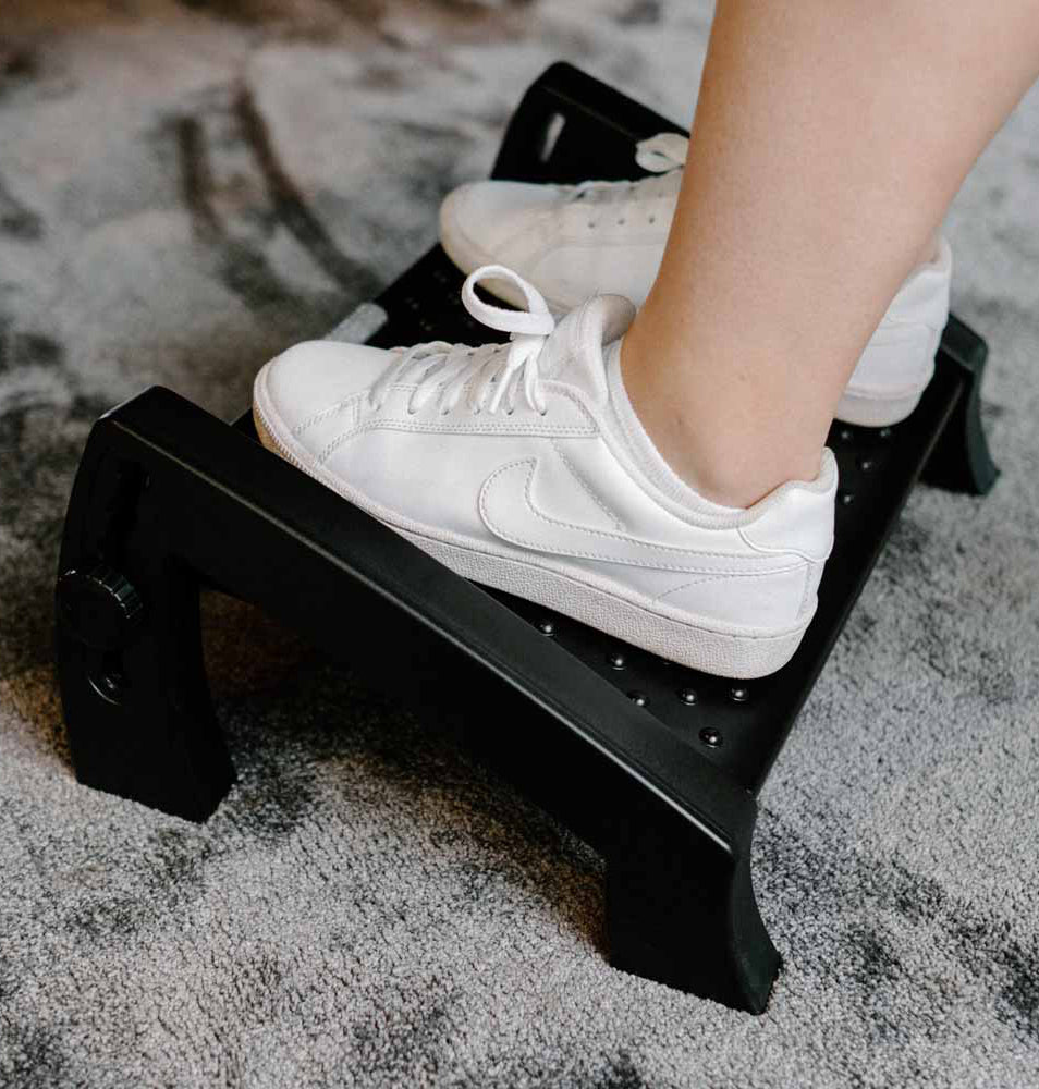 Ergonomic Footrest with adjustable height and flat texture for foot massage, designed for optimal comfort and posture support.