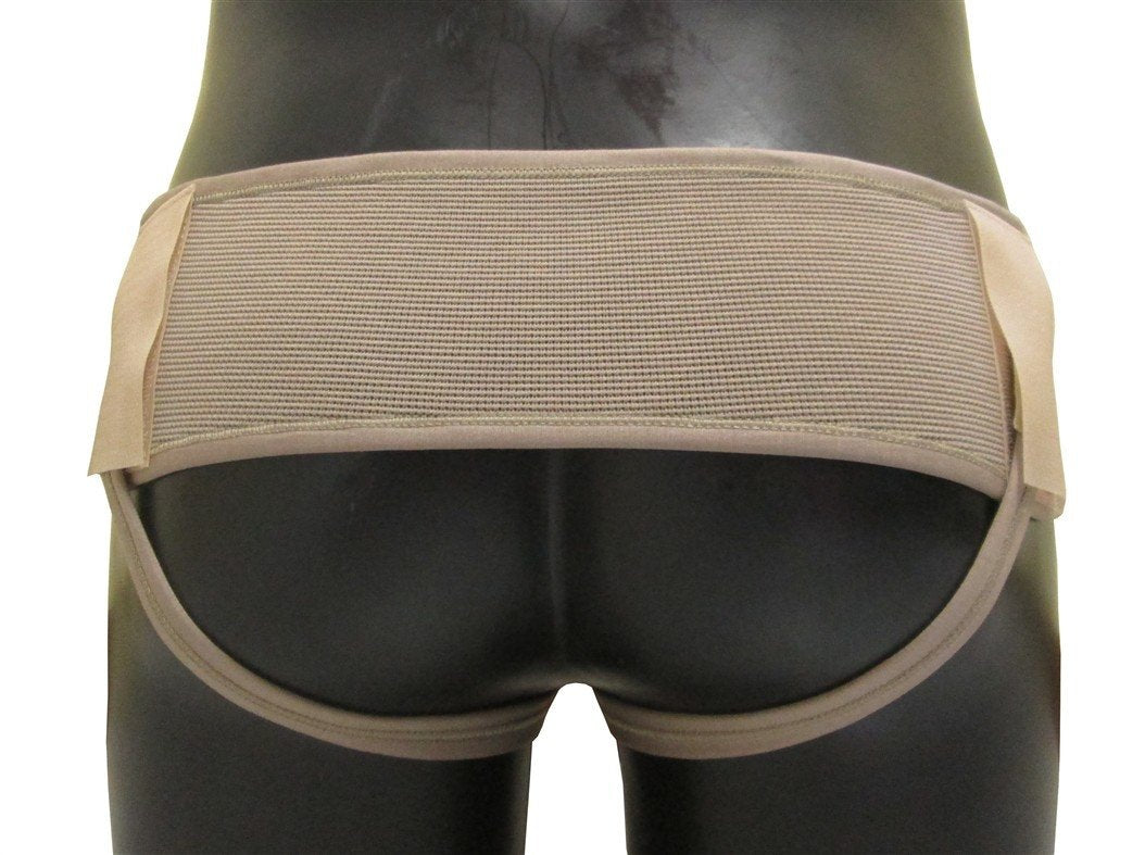 Bilateral inguinal hernia truss made of elastic fabric with two supportive pads.