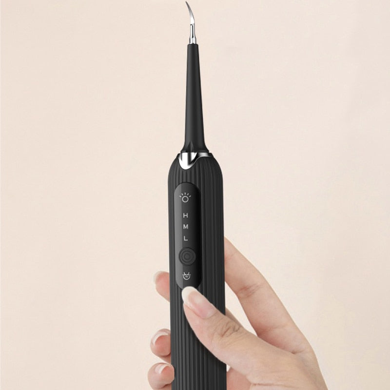 LED Sonic Electric Toothbrush with Dental Scaler, featuring multiple cleaning heads and USB charging capability, designed for effective teeth whitening.