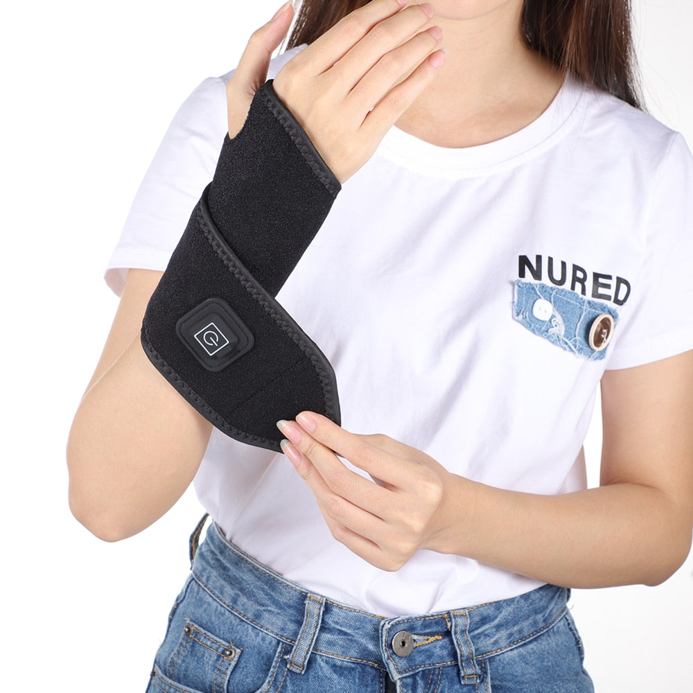 Magnetic Therapy Self-Heating Wrist Support Brace Wrap in black, showcasing its adjustable design and USB power supply.