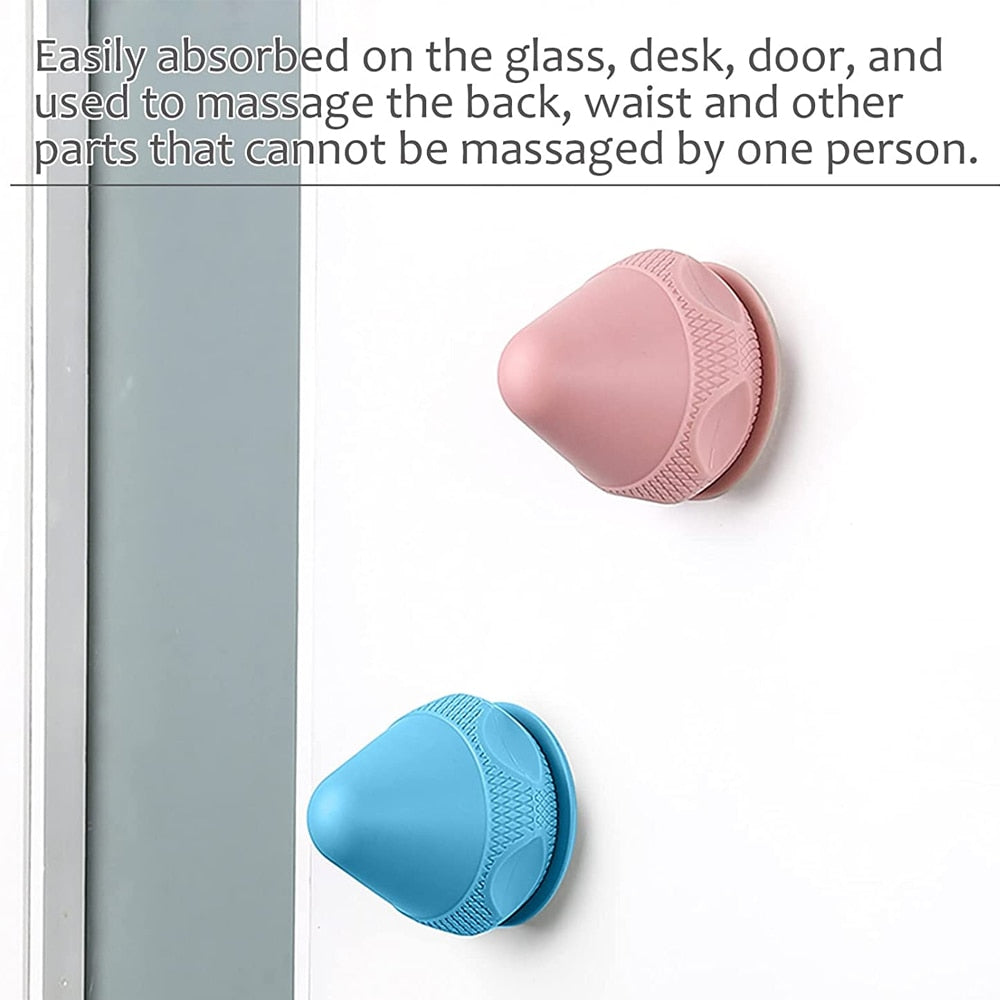 A silicone massage ball with a suction cup designed for deep tissue massage and muscle pain relief, showcasing its smooth surface and compact size.