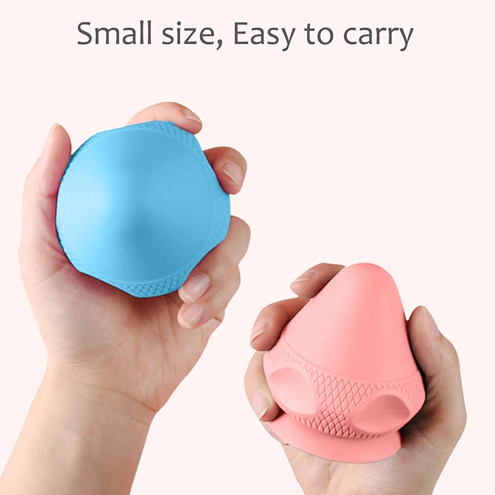 A silicone massage ball with a suction cup designed for deep tissue massage and muscle pain relief, showcasing its smooth surface and compact size.