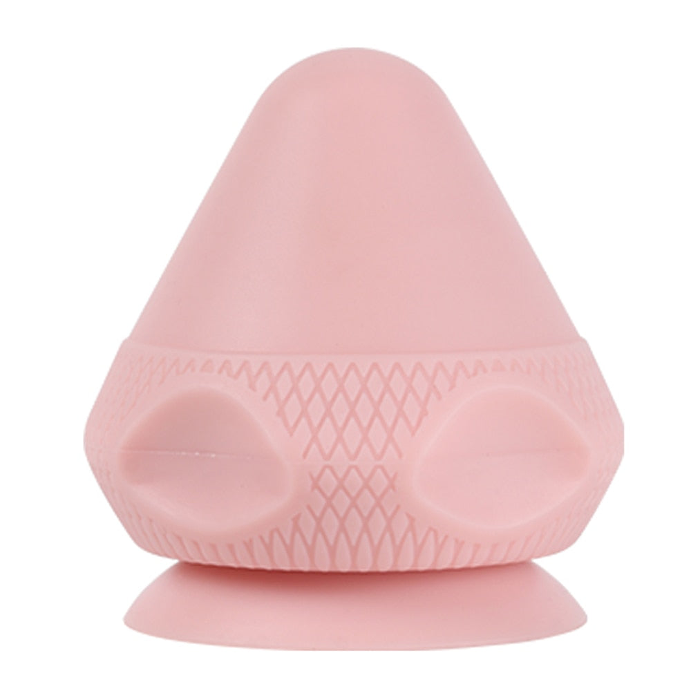 A silicone massage ball with a suction cup designed for deep tissue massage and muscle pain relief, showcasing its smooth surface and compact size.