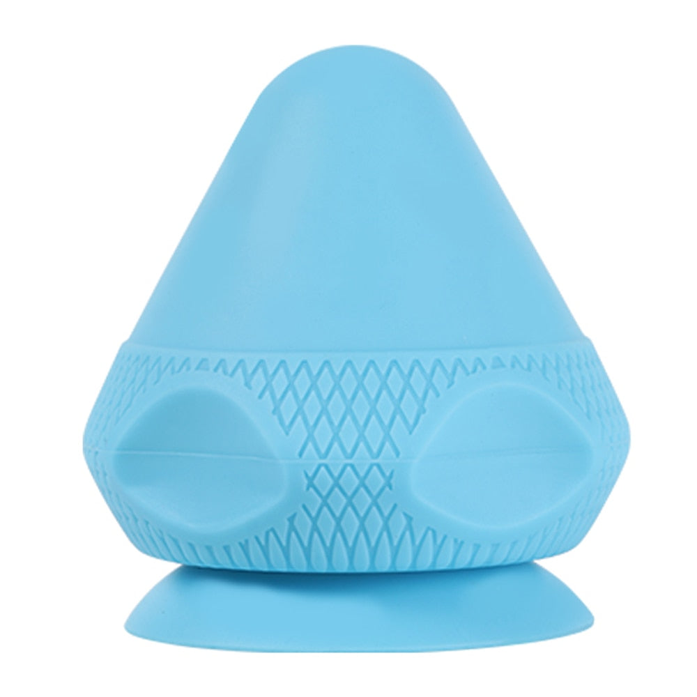 A silicone massage ball with a suction cup designed for deep tissue massage and muscle pain relief, showcasing its smooth surface and compact size.