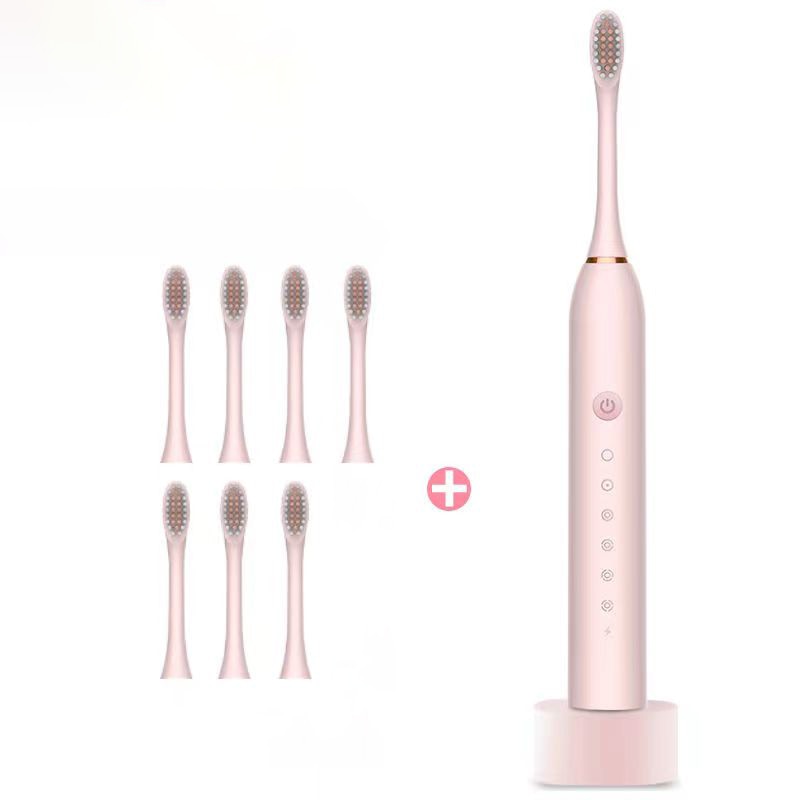 Newest Ultrasonic Electric Toothbrush with USB charger base, featuring multiple modes and replacement heads for effective dental care.