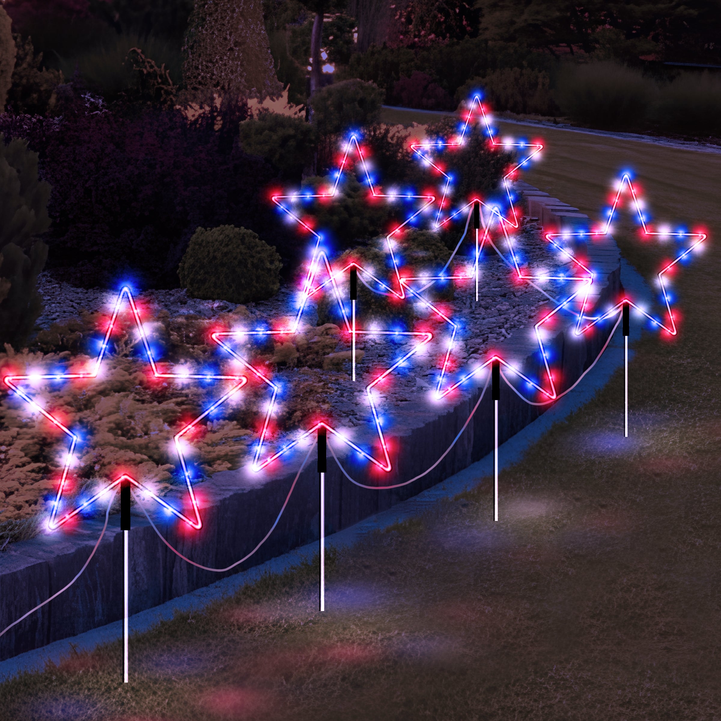 A set of 6 outdoor solar pathway lights shaped like stars, glowing in red, white, and blue colors, perfect for patriotic decorations.