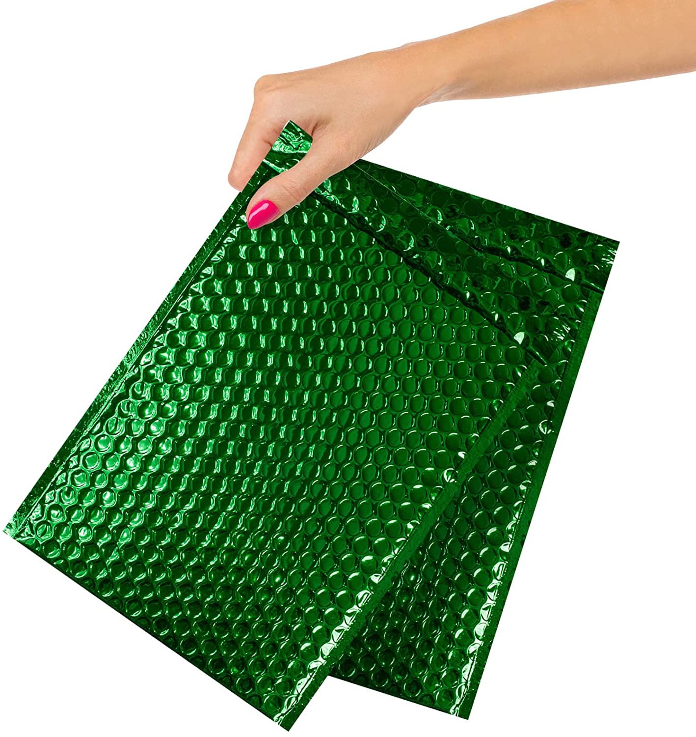 Green bubble mailers in hand.