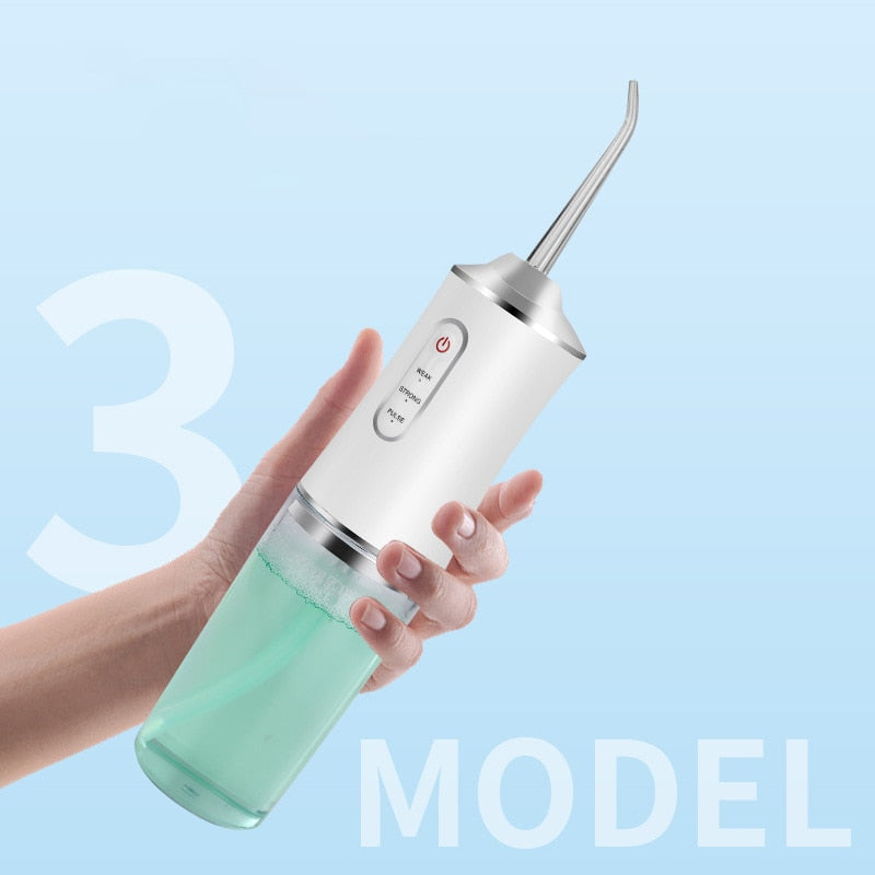 Portable Dental Irrigator Water Jet Flosser in white color with USB charging port and three mode settings, designed for effective oral hygiene.