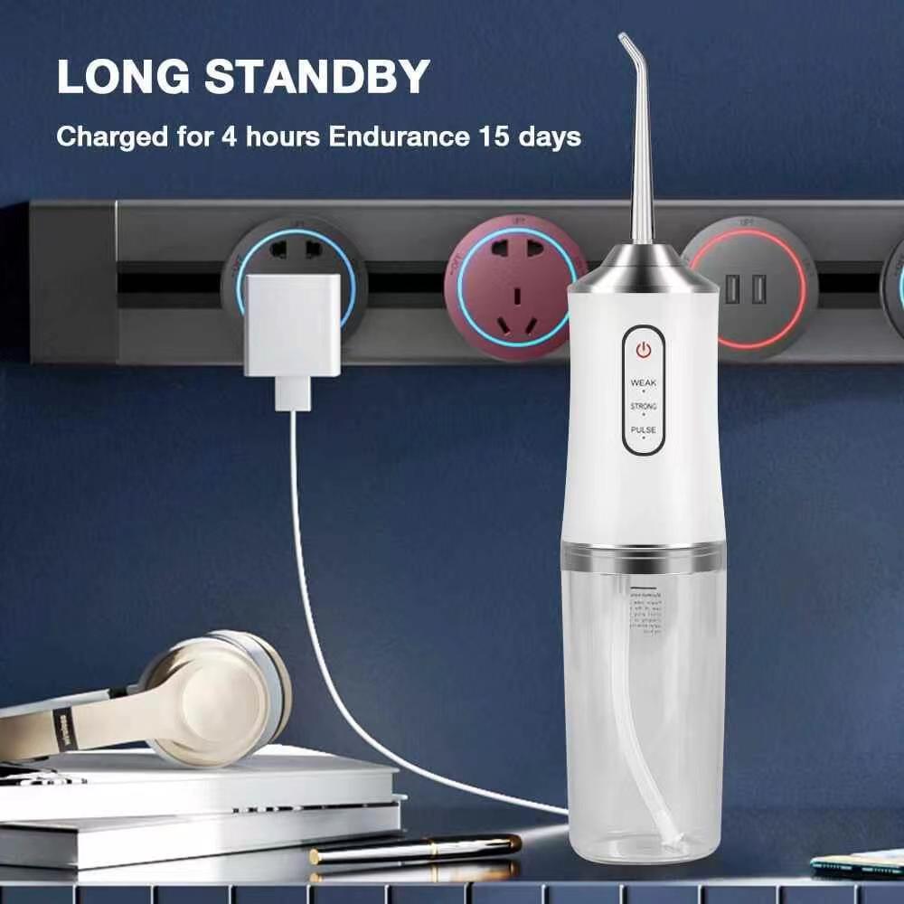 Portable Dental Irrigator Water Jet Flosser in white color with USB charging port and three mode settings, designed for effective oral hygiene.