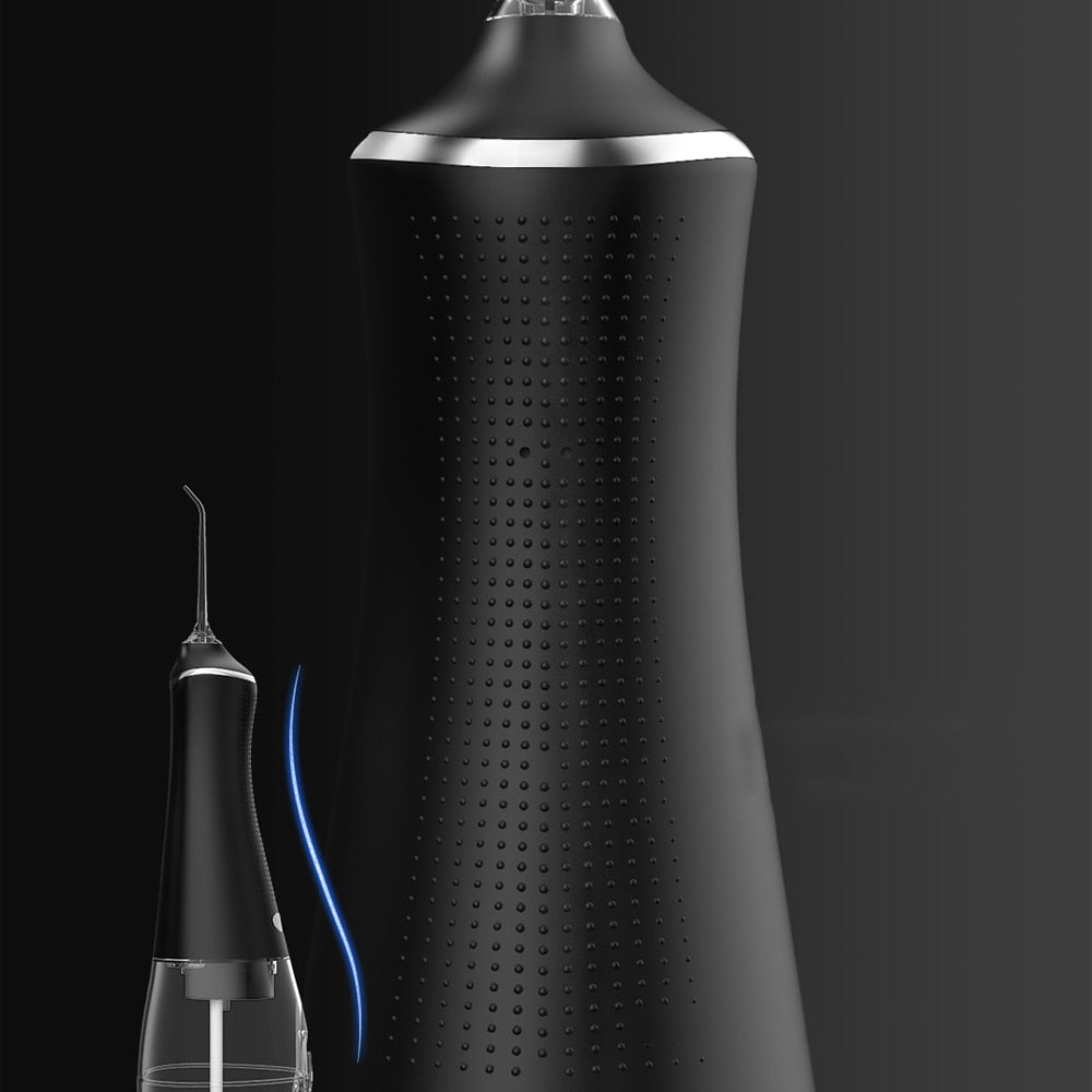 Portable Oral Irrigator Dental Water Flosser with multiple nozzles and USB charging cable, designed for effective oral hygiene.