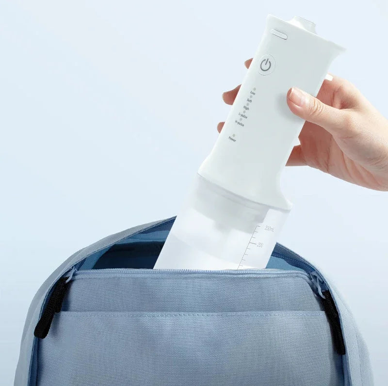 Portable Oral Irrigator Water Flosser with a sleek design, featuring a water tank and nozzle for effective oral cleaning.