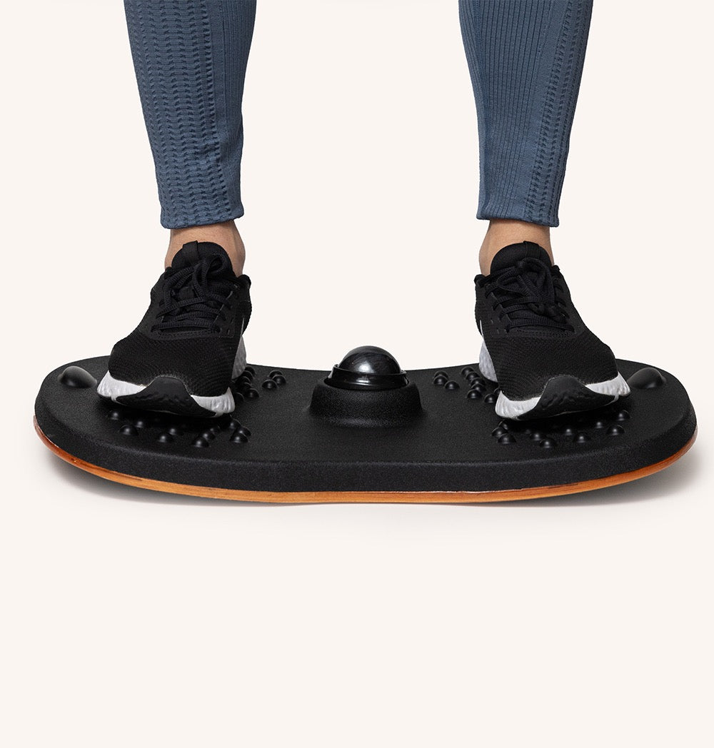 Standy Balance Board designed for balance training and daily movement, featuring a non-slip surface and massage ball for foot comfort.