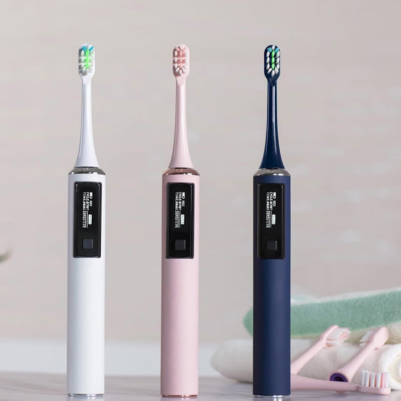Ultrasonic Electric Toothbrush in white color with OLED display and wireless charging rack, showcasing its sleek design and advanced features.