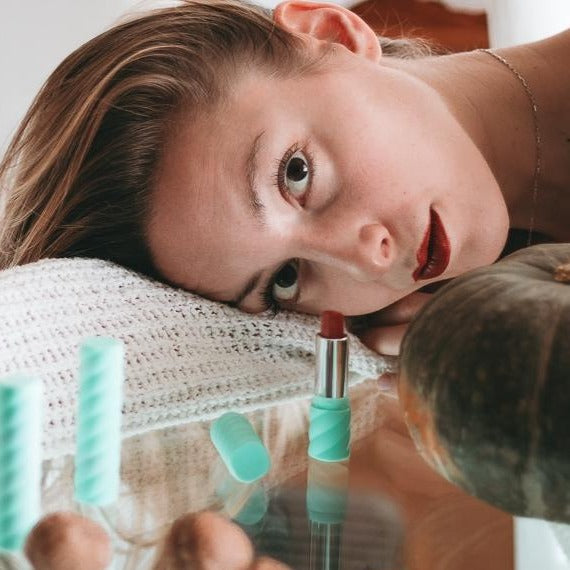 A close-up of 06 Rossetto 'Lady Maple from Colorland', showcasing its warm brick red color and creamy texture in a stylish packaging.