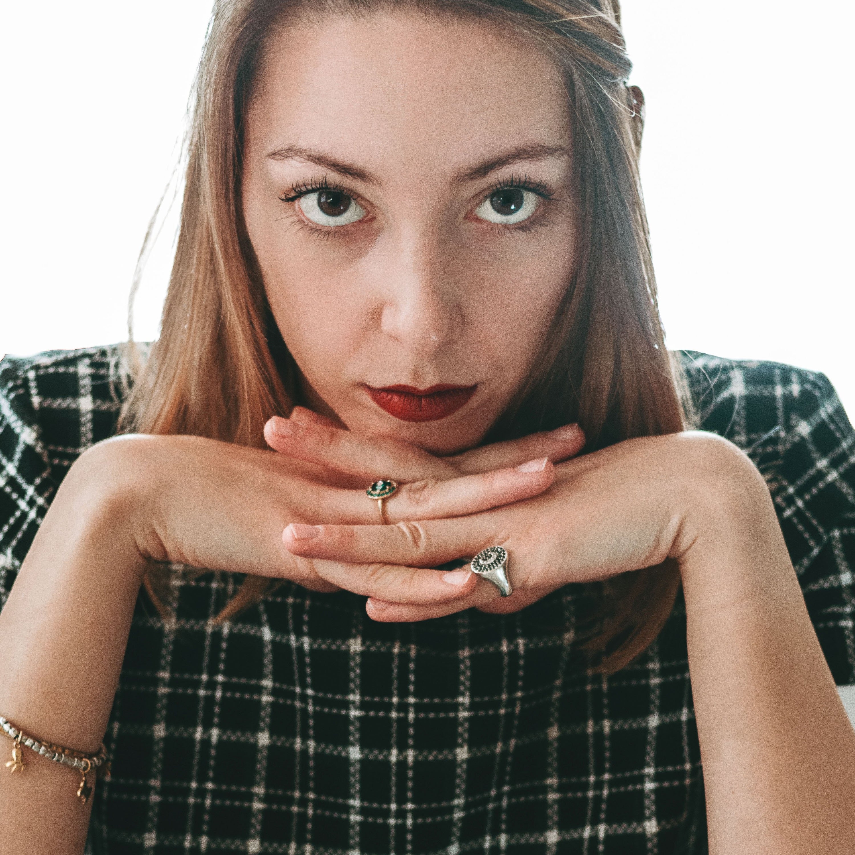 A close-up of 06 Rossetto 'Lady Maple from Colorland', showcasing its warm brick red color and creamy texture in a stylish packaging.