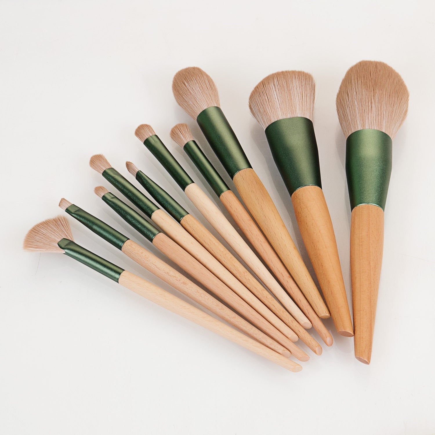 10-piece makeup brush set with nature wood handles and green pineapple bag, showcasing various brush types for makeup application.