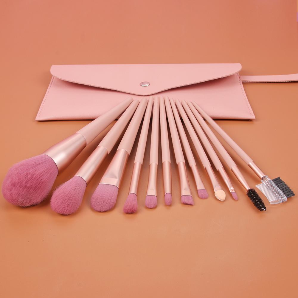 A stylish 12-piece nude pink makeup brush set featuring various brushes for flawless makeup application, including eyelash curlers and eyeshadow brushes.