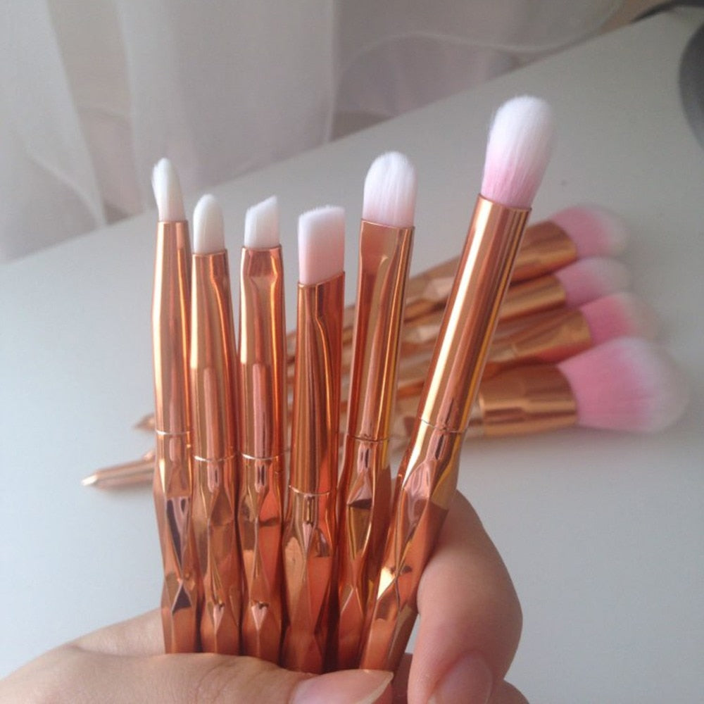 11Pcs Diamond Rose Gold Makeup Brushes Set featuring mermaid fishtail design, showcasing various brushes in elegant rose gold and purple colors.