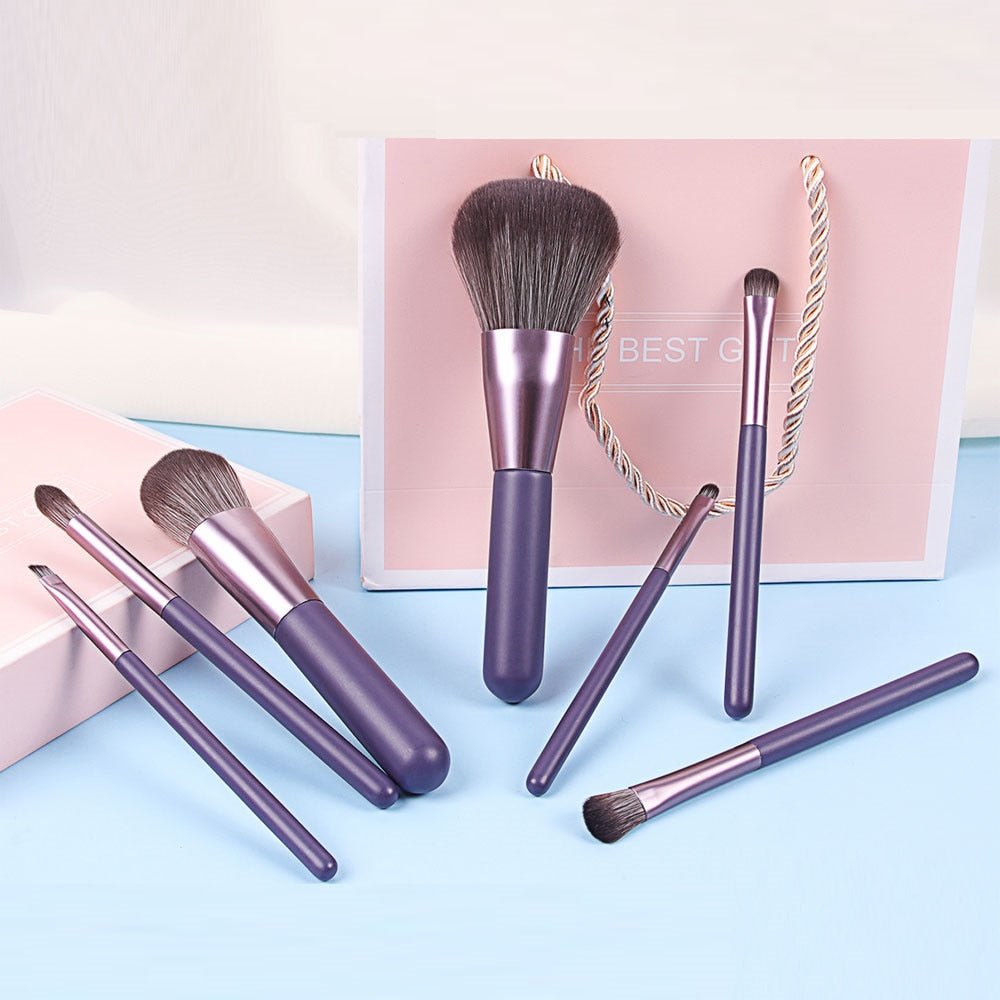 7PC Makeup Brush Set in a pink blush case, featuring high-quality nylon hair brushes with wood handles, perfect for makeup application.