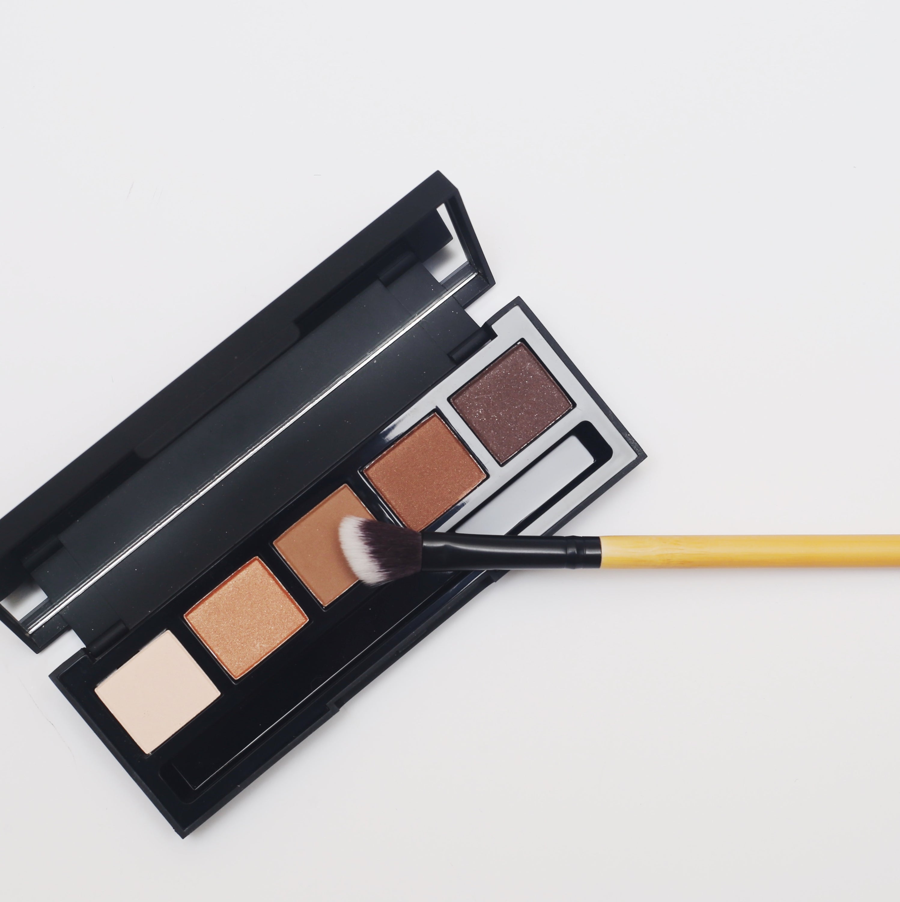 Angled Blending Bamboo Makeup Brush with soft synthetic bristles and durable bamboo handle, ideal for contouring and blending makeup.