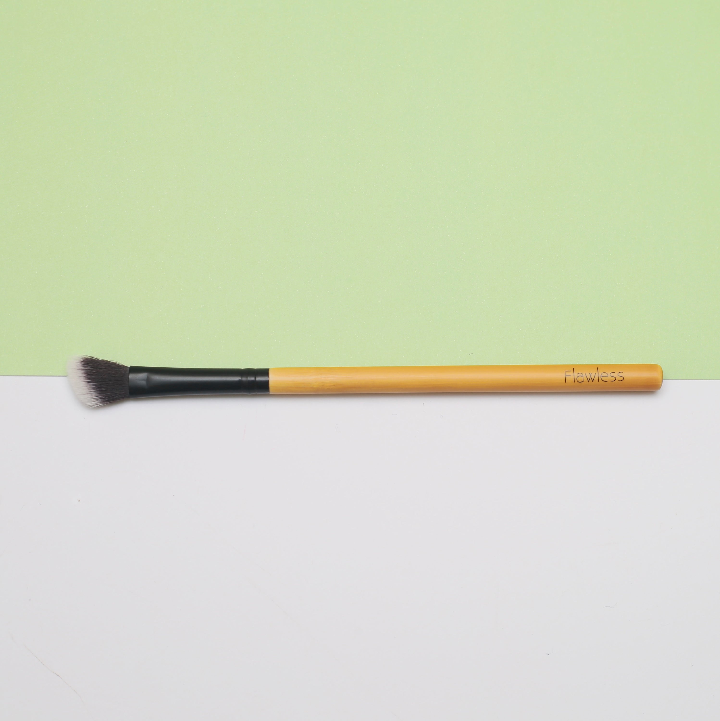 Angled Blending Bamboo Makeup Brush with soft synthetic bristles and durable bamboo handle, ideal for contouring and blending makeup.