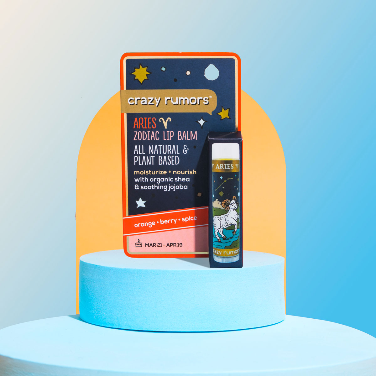 A vibrant product tube representing Aries, featuring fresh citrus and aromatic spice flavors, elegantly packaged in a gift box.