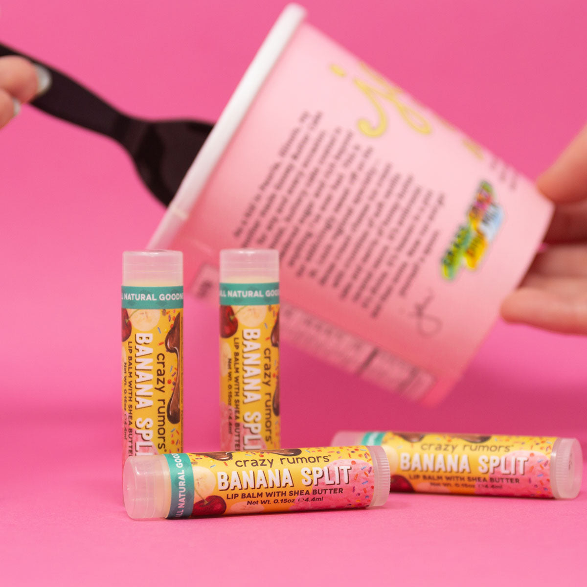 A vibrant Banana Split treat showcasing a blend of bananas, chocolate, and strawberries, topped with creamy vanilla, all in a 0.15oz tube.