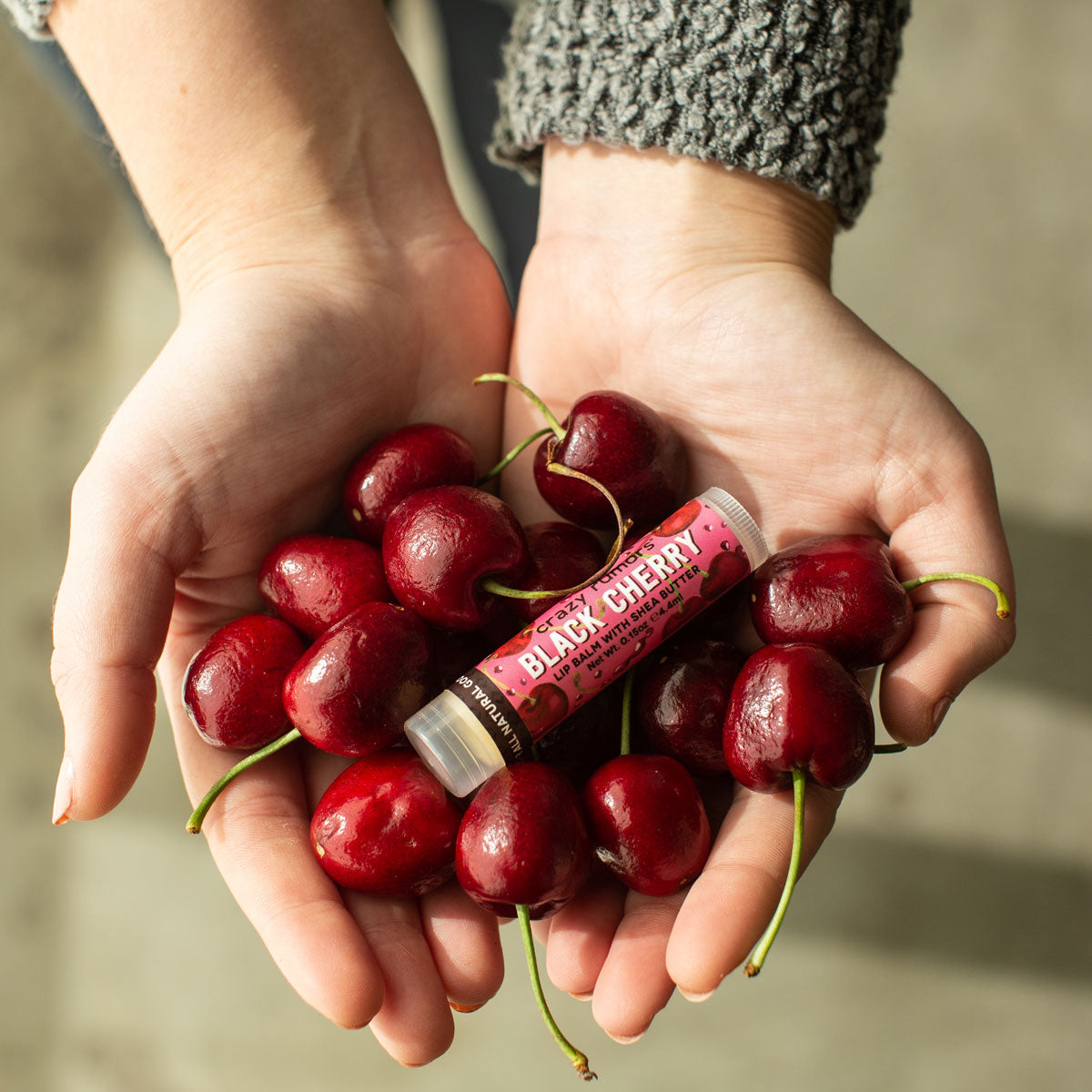 A 0.15oz tube of Black Cherry flavor product, showcasing its vibrant packaging and natural ingredients, perfect for a sweet indulgence.