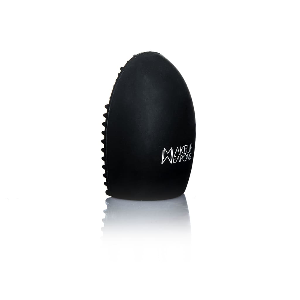 Brush Exfoliator Pad designed for deep cleaning makeup brushes, featuring small knobs and grooves for effective lathering.