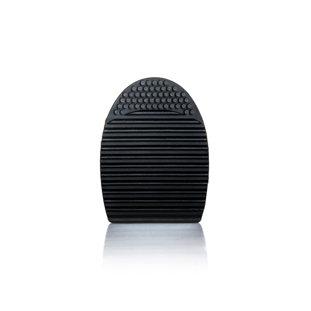 Brush Exfoliator Pad designed for deep cleaning makeup brushes, featuring small knobs and grooves for effective lathering.