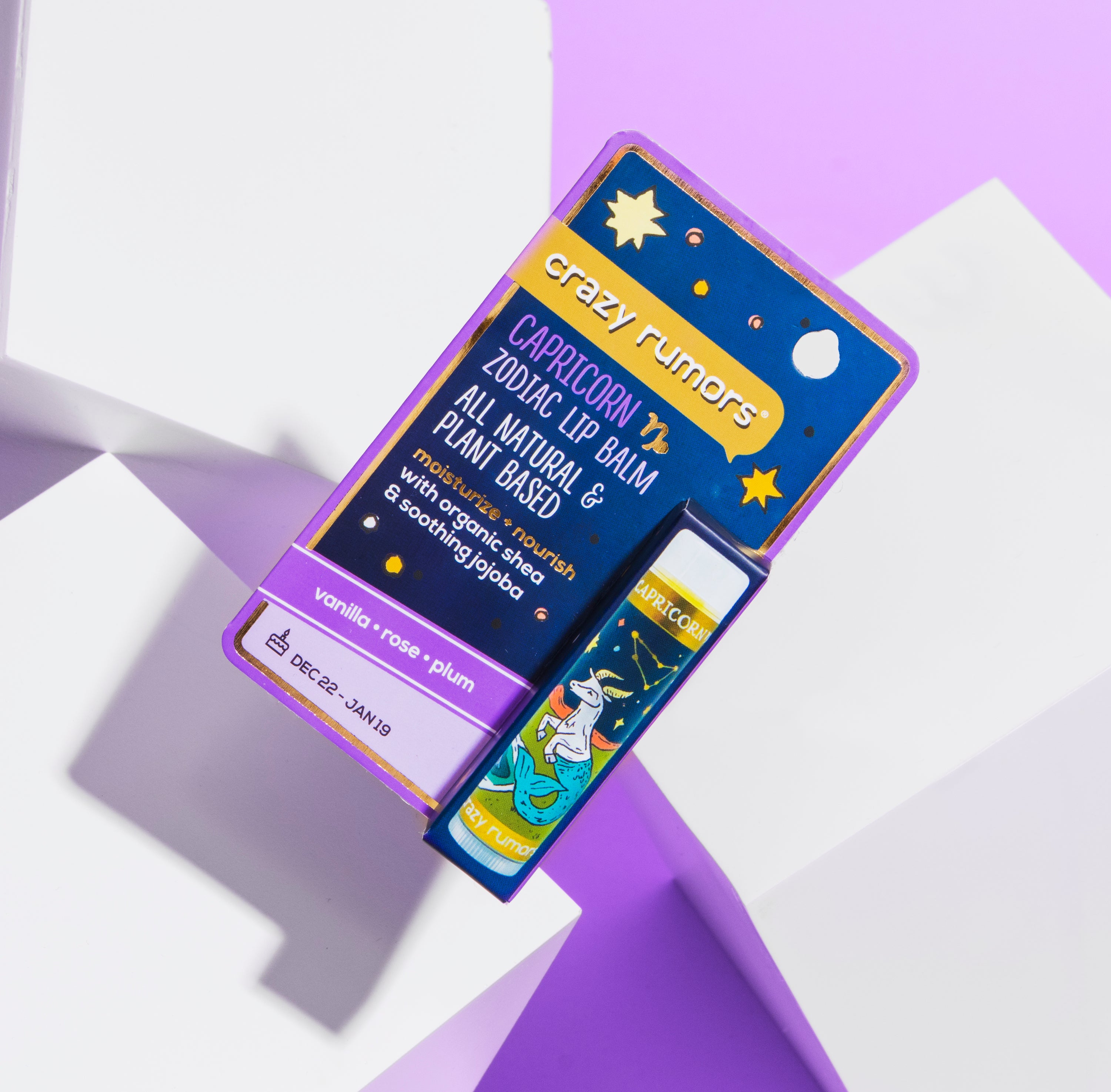 Capricorn lip balm in a 0.15oz tube, featuring a sweet vanilla and rose flavor profile, elegantly packaged in a gift box.