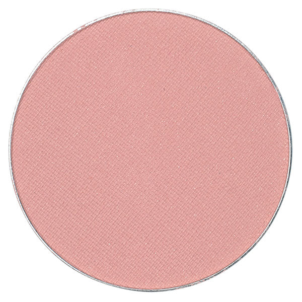CHARISMA-MUTED PALE PINK matte powder blush in a sleek container, showcasing its soft pink color and smooth texture.