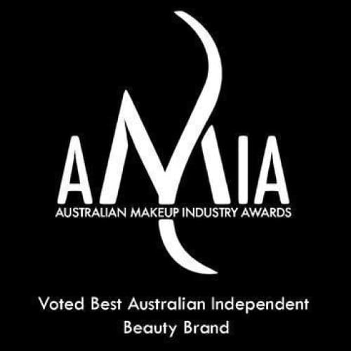 A set of 12 vegan professional makeup brushes with bamboo handles and soft bristles, displayed in a stylish arrangement.