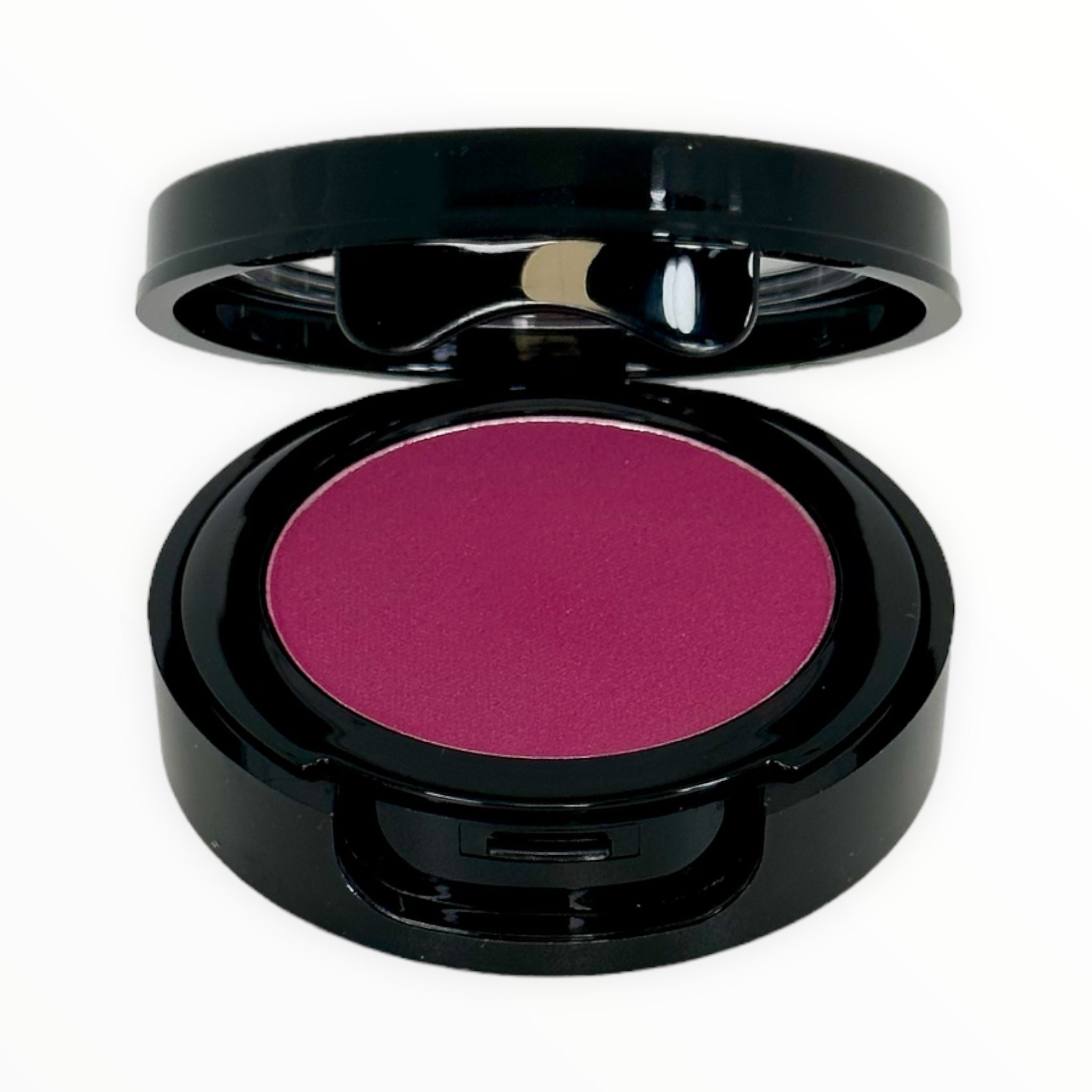 FINE WINE-DEEP MAGENTA matte powder blush in a sleek container, showcasing its rich magenta color.