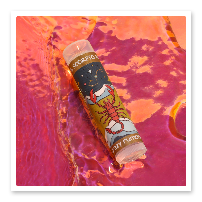 Scorpio lip balm in a 0.15oz tube with a tropical mango and citrus flavor profile, elegantly packaged in a gift box.