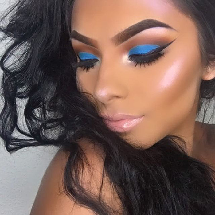 Supernova Iridescent Duochrome Loose Diamond Highlighter in a sleek container, showcasing its shimmering blue/violet powder.