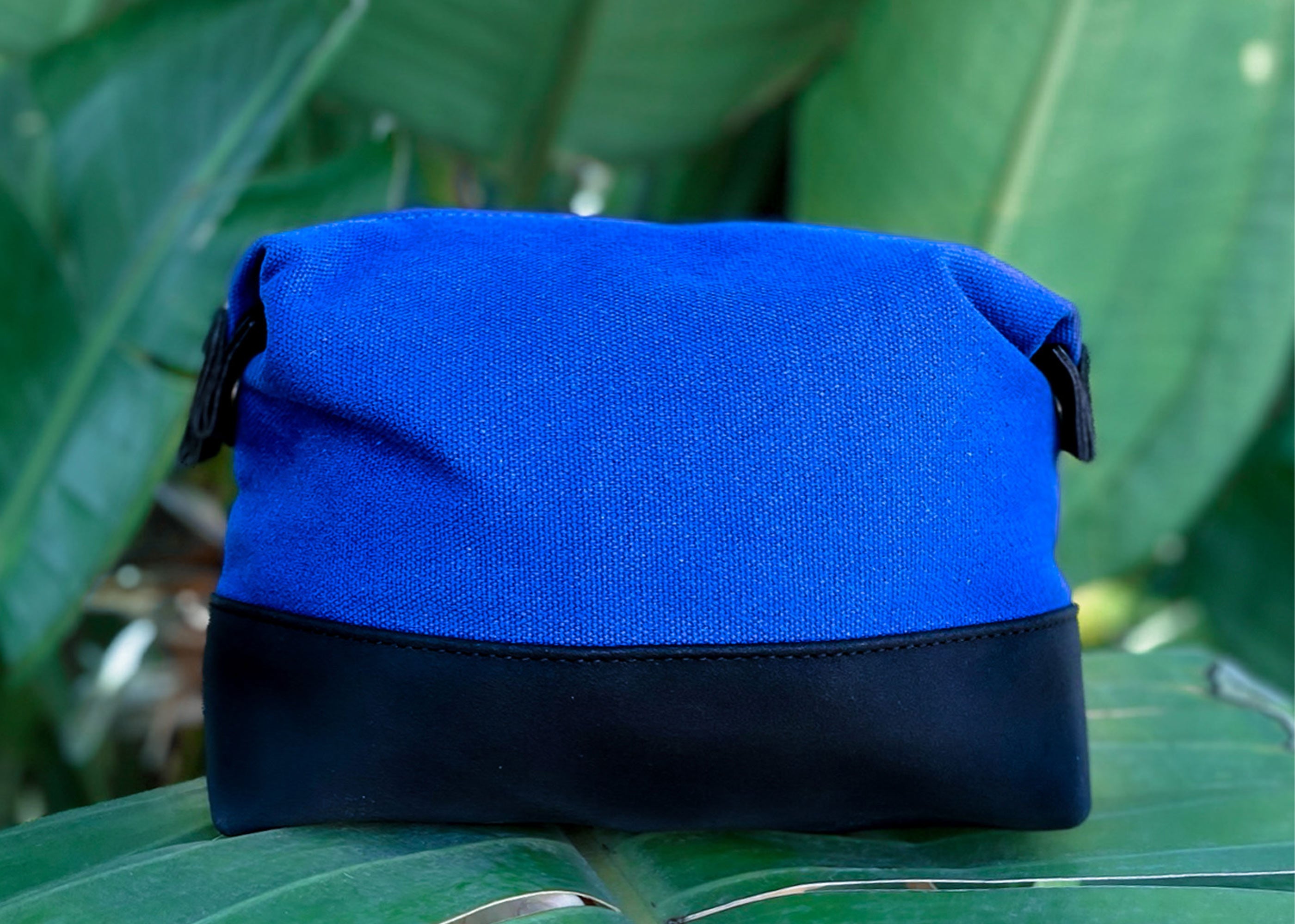 Travel Toiletry Bag in Cobalt Blue, featuring a stylish design with snap-down sides and eco-friendly materials for organized travel.