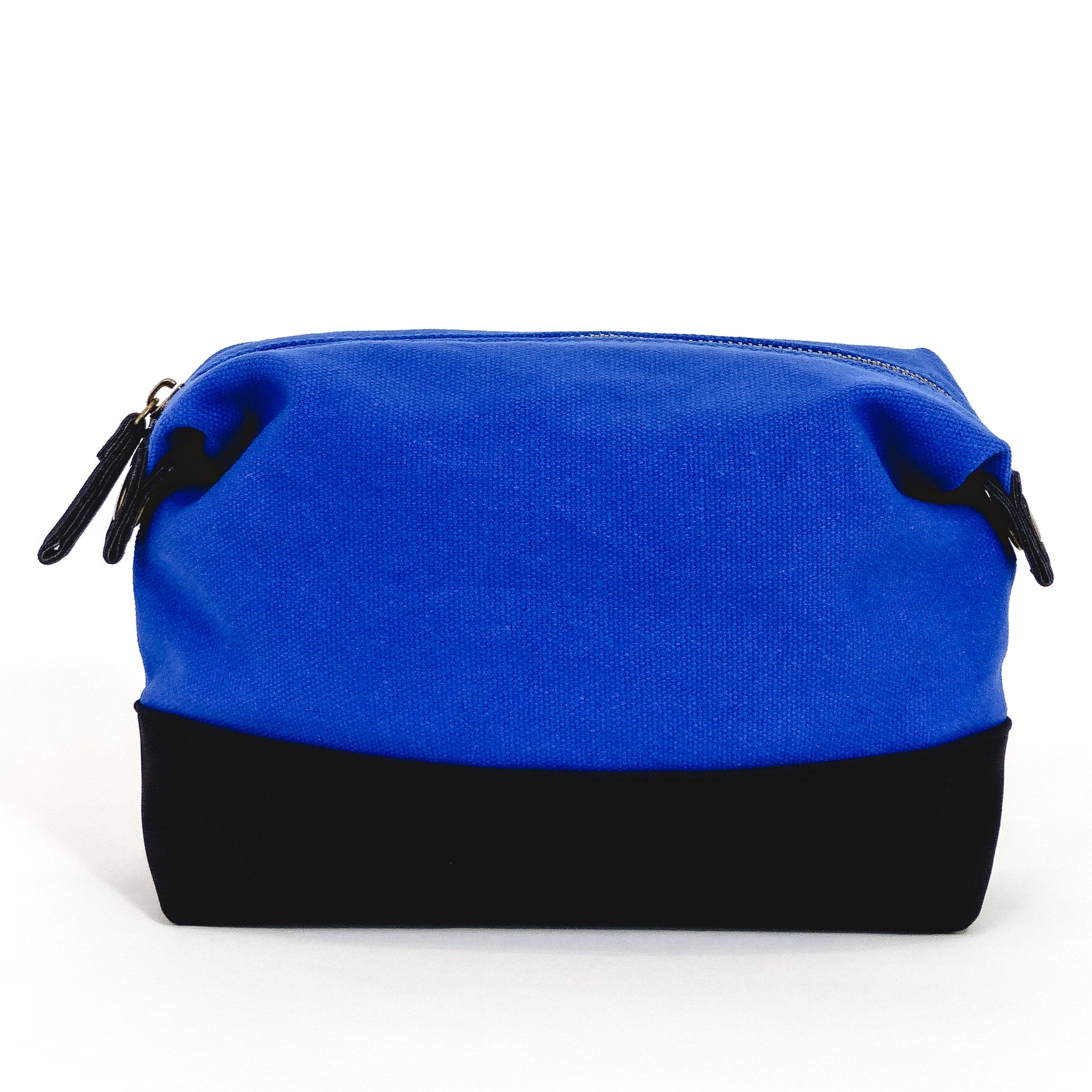 Travel Toiletry Bag in Cobalt Blue, featuring a stylish design with snap-down sides and eco-friendly materials for organized travel.
