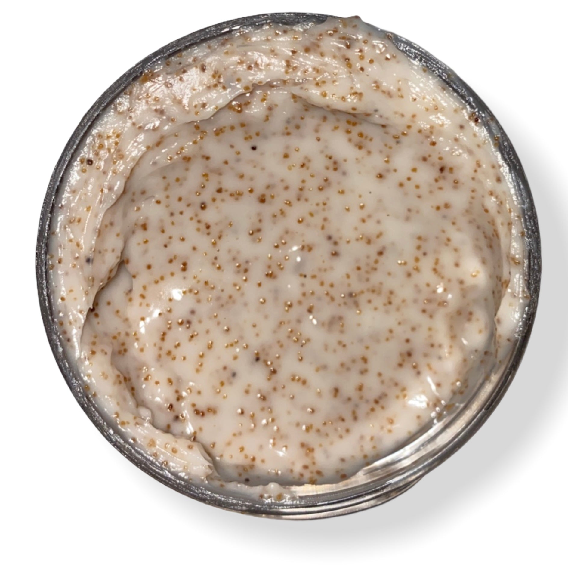 A jar of Walnut Body Scrub with creamy texture, showcasing its natural ingredients and luxurious appeal.