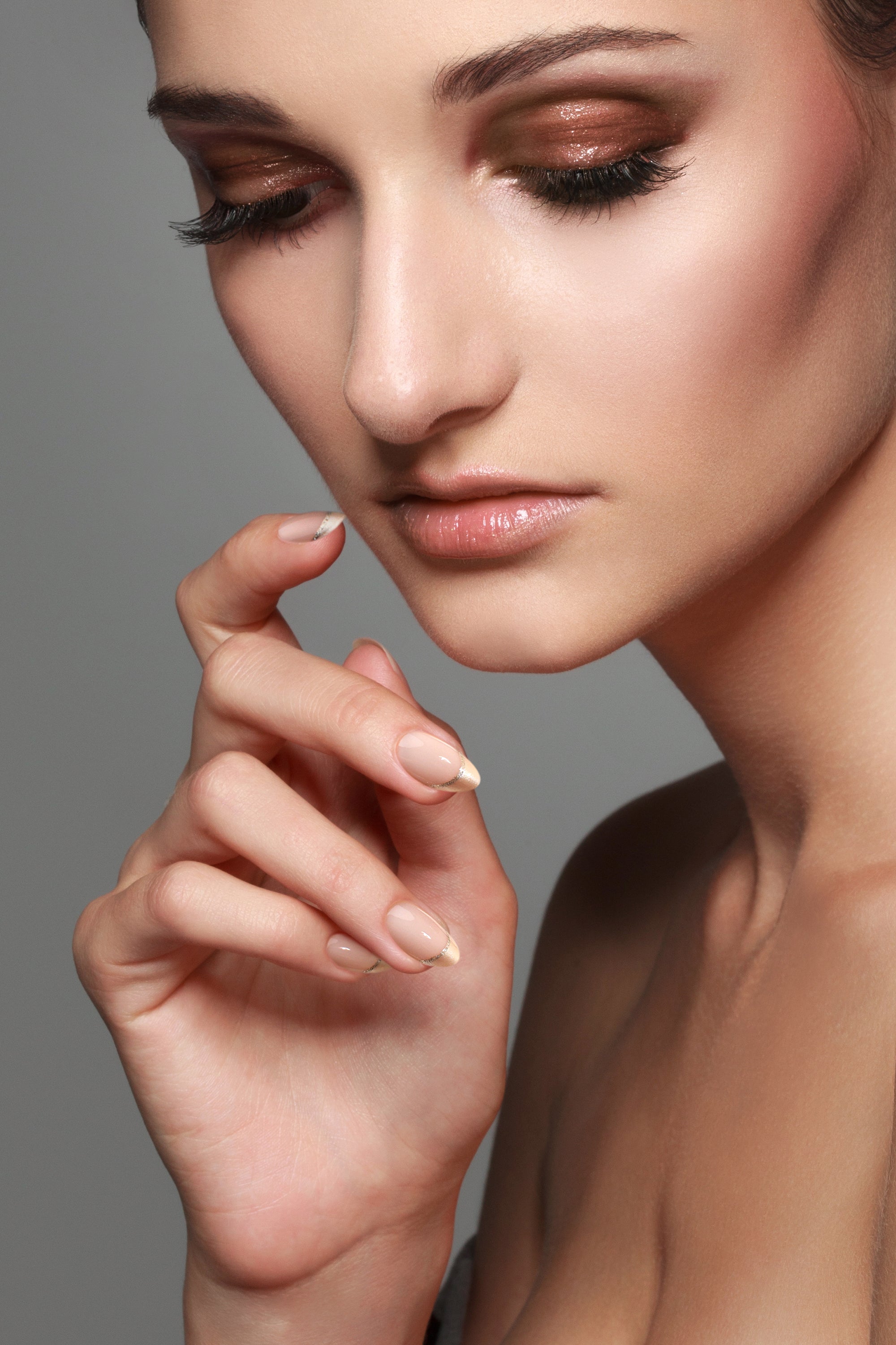 Champagne Stardust press-on nails featuring a champagne color with sparkling accents, elegantly displayed in a manicure set.