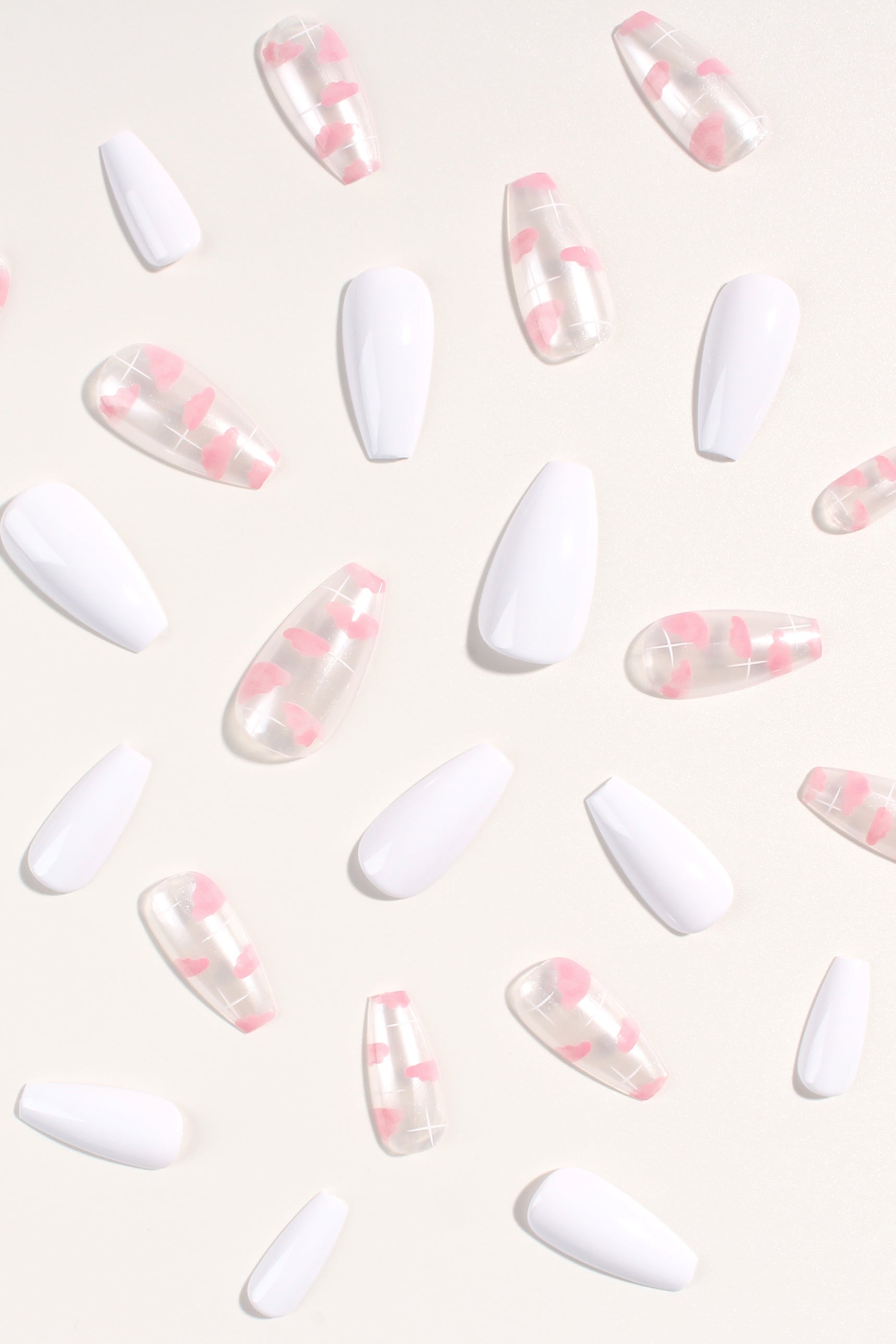 Cloud Waltz press-on nails featuring a soft pink-tinted design, perfect for elegant manicures.