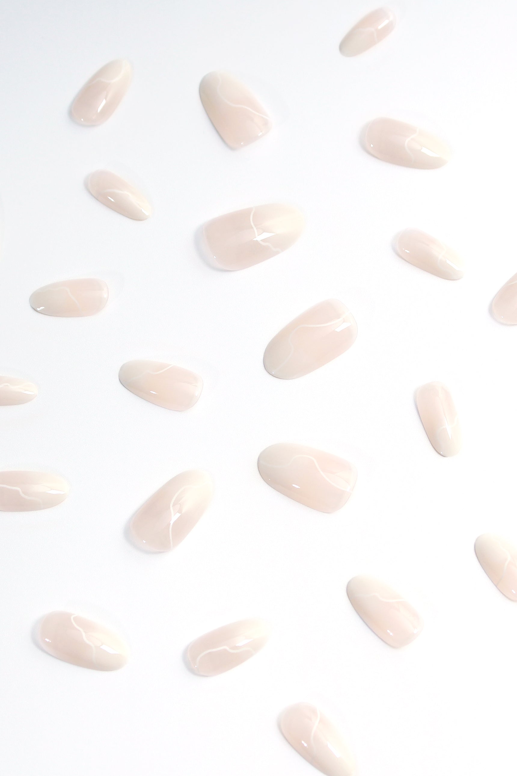 Cream Swirl press-on nails featuring a beautiful swirl design in soft cream color, perfect for stylish manicures.