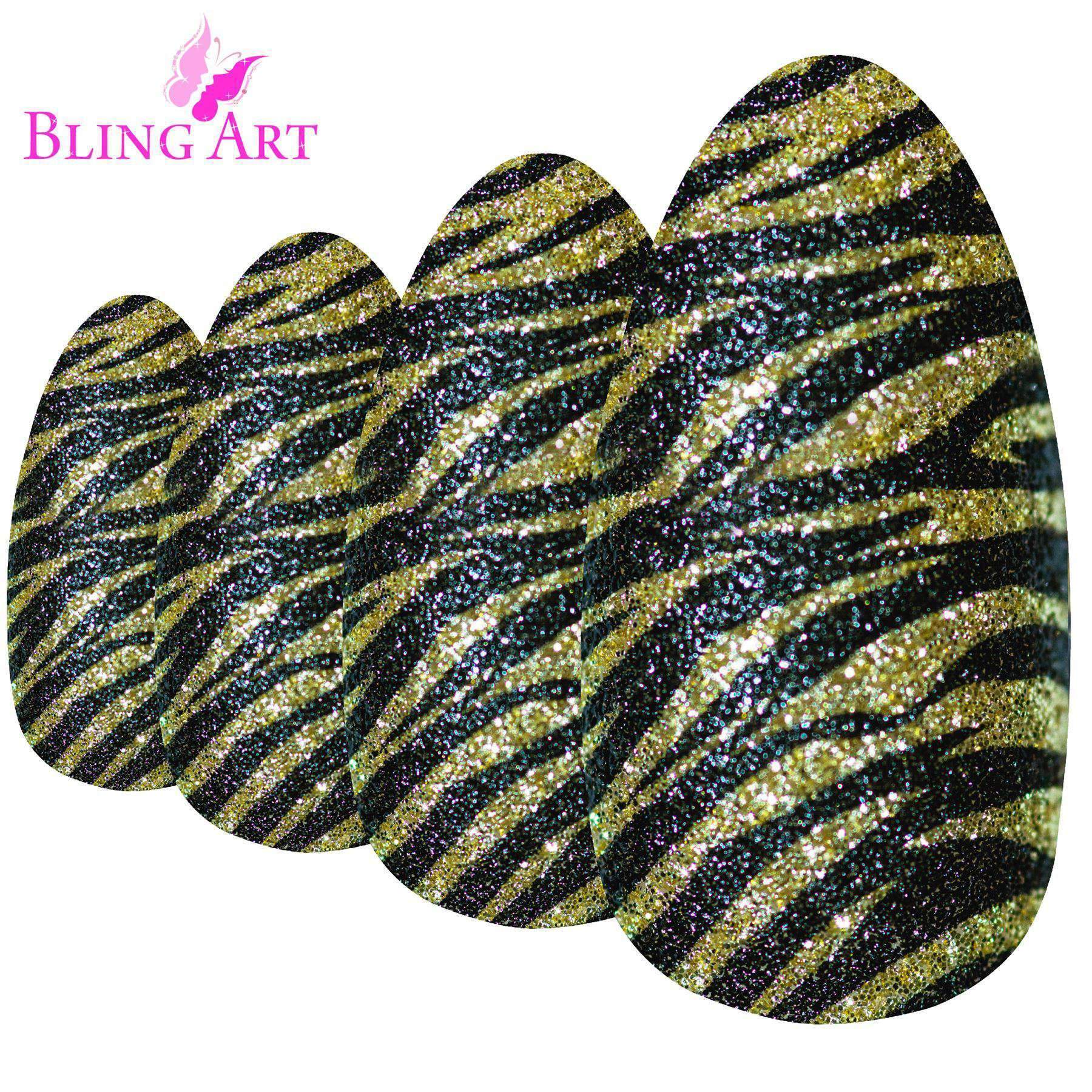 A set of 24 long almond stiletto false nails in black and gold glitter design, accompanied by a glue stick, nail file, and cuticle stick.