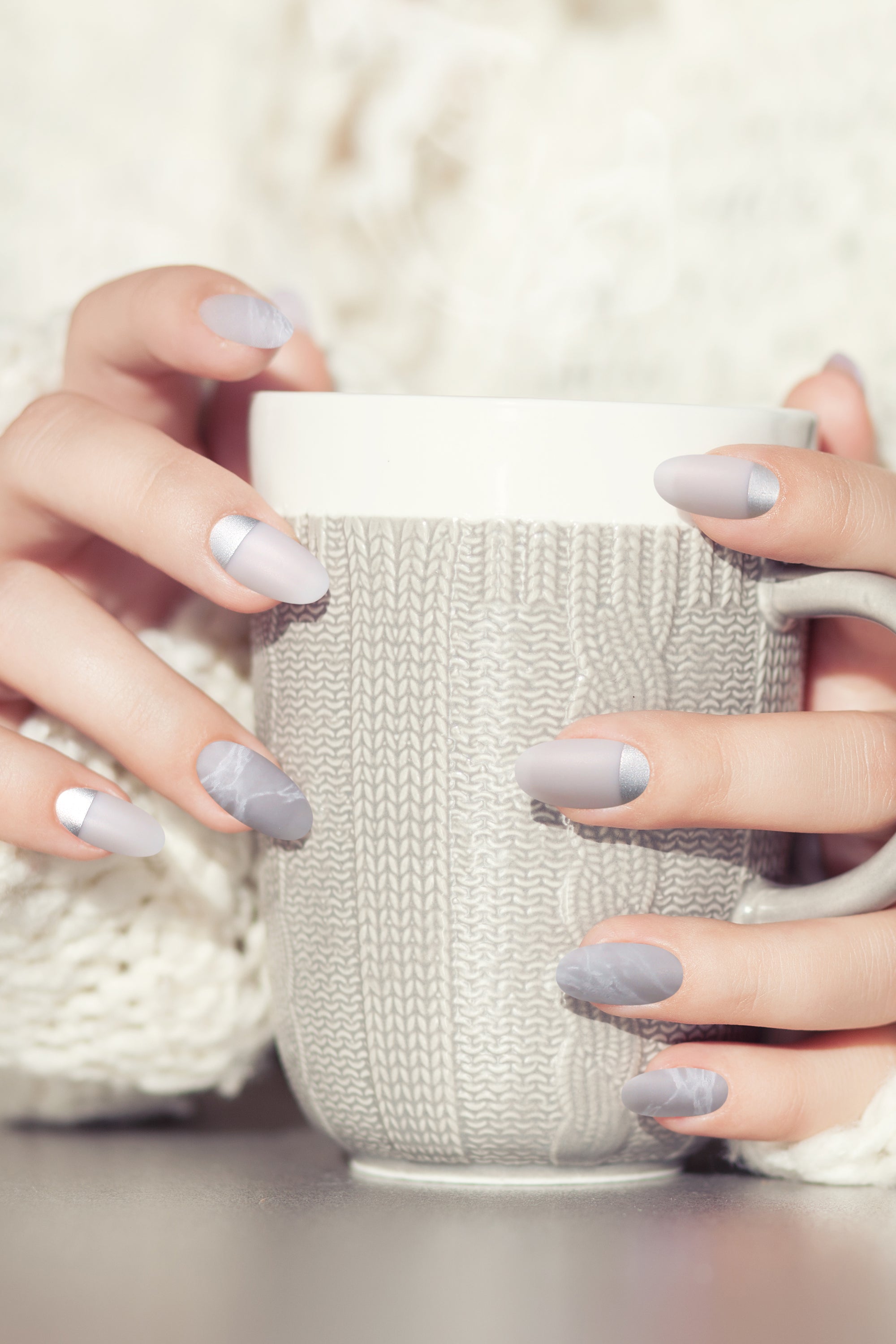 Grace press-on nails featuring a serene marble design in shades of grey with a matte finish, elegantly displayed.